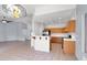 Spacious open-concept living space with seamless flow between living room, kitchen, and dining area, and tiled floors at 531 Coolidge Ave, Henderson, NV 89015