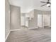 Open main bedroom leading to en suite bathroom, featuring neutral carpet and lighting at 531 Coolidge Ave, Henderson, NV 89015