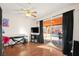 This bedroom features laminated floors, a large glass patio door and lots of natural light at 5717 Christchurch Ave, Las Vegas, NV 89110
