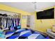 Bright bedroom with ceiling fan, large window, laminated floors and closet at 5717 Christchurch Ave, Las Vegas, NV 89110