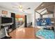 Cozy bedroom with wooden floors, bunk beds and large sliding glass doors to outdoor patio at 5717 Christchurch Ave, Las Vegas, NV 89110