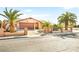 Inviting single-story home showcasing well-maintained landscaping and a private driveway at 5717 Christchurch Ave, Las Vegas, NV 89110
