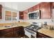 Detailed shot of the kitchen featuring a modern gas range and stainless steel appliances at 5717 Christchurch Ave, Las Vegas, NV 89110