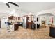 Well-equipped kitchen with stainless steel appliances, granite counters, and cherry cabinets at 5717 Christchurch Ave, Las Vegas, NV 89110