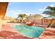 Backyard pool with rock details, offering a serene and tropical atmosphere for leisure and entertainment at 5717 Christchurch Ave, Las Vegas, NV 89110