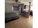 A bedroom with a large bed and an adjoining kitchen area with a bar at 6225 Factor Ave, Las Vegas, NV 89107
