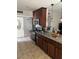 Well-equipped kitchen with stainless steel appliances, granite countertops, and stylish lighting at 6225 Factor Ave, Las Vegas, NV 89107