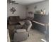 Inviting living room featuring a comfortable sectional sofa and an upright piano at 6225 Factor Ave, Las Vegas, NV 89107