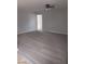 Spacious living room featuring neutral carpeting and a ceiling fan, providing a comfortable and inviting atmosphere at 6225 Factor Ave, Las Vegas, NV 89107