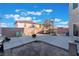 Backyard featuring a brick wall, basketball hoop, trampoline, concrete patio, and outdoor seating at 6552 Casamar St, North Las Vegas, NV 89086