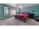 Bedroom with bright green ivy wallpaper and accents, large bed, and window at 6552 Casamar St, North Las Vegas, NV 89086