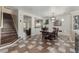 Dining room with a classic wooden table and chairs, adjacent to the staircase at 6552 Casamar St, North Las Vegas, NV 89086