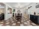 Open-concept dining area with stylish furnishings and abundant natural light at 6552 Casamar St, North Las Vegas, NV 89086