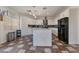 Spacious kitchen with a sizable island, black refrigerator, and ample counter space at 6552 Casamar St, North Las Vegas, NV 89086
