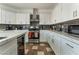 Bright kitchen featuring white cabinets, stainless steel appliances, and stylish countertops at 6552 Casamar St, North Las Vegas, NV 89086