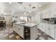 Open-concept kitchen with a large island, breakfast bar, and modern appliances, ideal for cooking and socializing at 6552 Casamar St, North Las Vegas, NV 89086