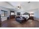 Main bedroom with a sitting area, dark wood floors, and ample natural light at 6552 Casamar St, North Las Vegas, NV 89086