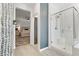 Bright bathroom featuring walk-in shower with hallway and bedroom views at 7122 Red Gulch St, North Las Vegas, NV 89084