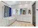 Modern bathroom featuring a bathtub and walk-in shower at 7122 Red Gulch St, North Las Vegas, NV 89084