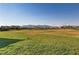 Large, green community space surrounded by homes with mountain views at 7122 Red Gulch St, North Las Vegas, NV 89084