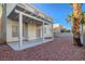 Charming backyard featuring a covered patio and gravel landscaping for easy maintenance and desert appeal at 7228 Buglehorn St, Las Vegas, NV 89131