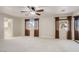Large primary bedroom with plush carpeting, ample natural light, and ensuite bathroom at 7228 Buglehorn St, Las Vegas, NV 89131