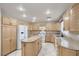 Well-lit kitchen with granite countertops, a kitchen island, and plenty of cabinet space for storage at 7228 Buglehorn St, Las Vegas, NV 89131