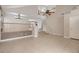 Spacious living area showcasing tile floors, soaring ceilings, and staircase leading to the upper level at 7228 Buglehorn St, Las Vegas, NV 89131