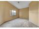 Bedroom with a neutral carpet, paint and natural light at 7772 Buckwood Ct, Las Vegas, NV 89149