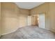 Cozy bedroom with neutral carpet ready for furnishings at 7772 Buckwood Ct, Las Vegas, NV 89149