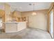 Open concept kitchen featuring a breakfast bar, and ample cabinet space at 7772 Buckwood Ct, Las Vegas, NV 89149