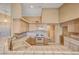 Kitchen boasts tile countertops, ample cabinet space, and gas range at 7772 Buckwood Ct, Las Vegas, NV 89149