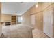 Bright living room with neutral carpet, fireplace, and ample natural light at 7772 Buckwood Ct, Las Vegas, NV 89149