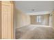 Spacious living room with neutral paint and carpet ready for furnishings at 7772 Buckwood Ct, Las Vegas, NV 89149