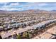 Expansive neighborhood aerial shot showcasing meticulously planned homes with mountain views at 80 Pristine Glen St, Las Vegas, NV 89135
