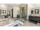 This bathroom features dual sinks, a glass enclosed shower, and modern fixtures at 80 Pristine Glen St, Las Vegas, NV 89135