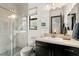 Bright bathroom showcases a glass-enclosed shower, modern vanity, and elegant fixtures at 80 Pristine Glen St, Las Vegas, NV 89135