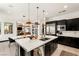 Gourmet kitchen with bar seating and stainless appliances, open floor plan and seamless access to the dining area at 80 Pristine Glen St, Las Vegas, NV 89135