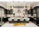 Gourmet kitchen featuring bar seating, stainless appliances, designer lighting and easy access to the dining area at 80 Pristine Glen St, Las Vegas, NV 89135