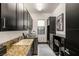 Well-equipped laundry room features modern appliances, ample cabinet space, and stylish design at 80 Pristine Glen St, Las Vegas, NV 89135