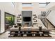 Elegant living room with sleek decor, a contemporary fireplace, and an open floor plan perfect for entertaining guests at 80 Pristine Glen St, Las Vegas, NV 89135