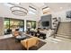 Bright living room with open layout, featuring a modern fireplace, neutral decor, and an inviting atmosphere at 80 Pristine Glen St, Las Vegas, NV 89135