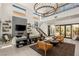 Stylish living room featuring high ceilings, modern lighting, and sophisticated decor, creating an inviting and luxurious ambiance at 80 Pristine Glen St, Las Vegas, NV 89135