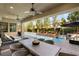 Inviting outdoor patio with a ceiling fan, lounge seating, and an attractive, built-in swimming pool at 80 Pristine Glen St, Las Vegas, NV 89135