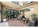 Cozy outdoor patio with comfortable seating, stylish planters, and seamless transition to the home's interior at 80 Pristine Glen St, Las Vegas, NV 89135