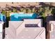 Aerial view of a private backyard featuring a stunning pool, elegant patio, and mature landscaping at 80 Pristine Glen St, Las Vegas, NV 89135