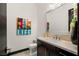 Modern powder room features a sleek vanity, stylish mirror, and unique artwork for a contemporary touch at 80 Pristine Glen St, Las Vegas, NV 89135