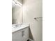 Bathroom sink with a white cabinet and marble countertops at 8224 Crystal Star Ct, Las Vegas, NV 89145