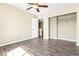 Bedroom featuring new hardwood floors, a ceiling fan, and a spacious closet at 8224 Crystal Star Ct, Las Vegas, NV 89145