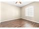Bedroom with hardwood floors, neutral walls and a window with shutters at 8224 Crystal Star Ct, Las Vegas, NV 89145